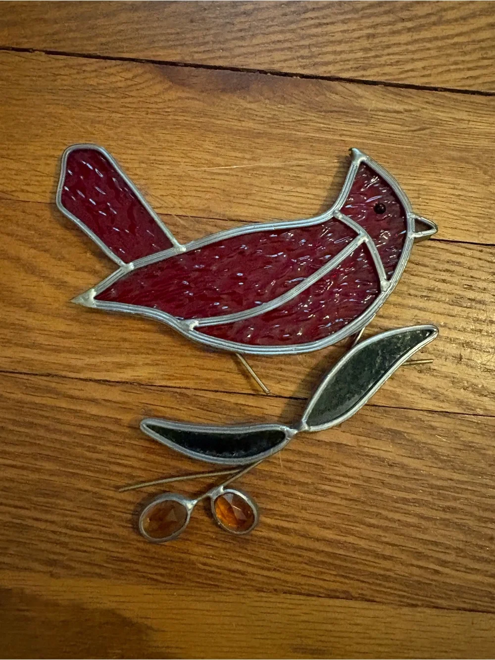 Vintage stained glass suncatcher cardinal on a branch